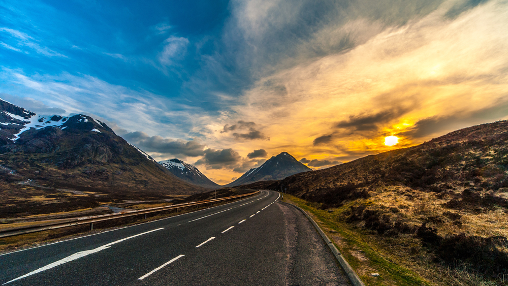 The A28 road crossing the Highlands in Scotland at sunset 